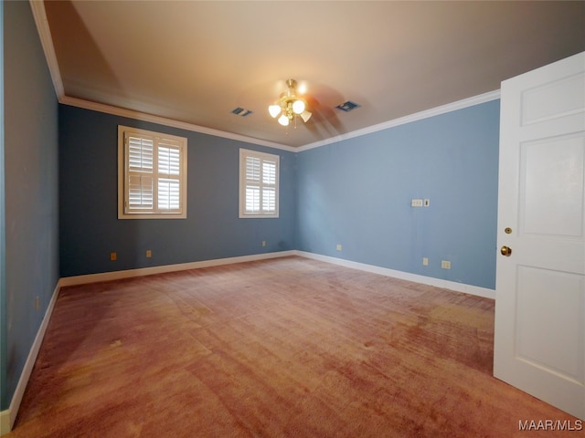 spare room featuring ornamental molding, carpet flooring, and ceiling fan