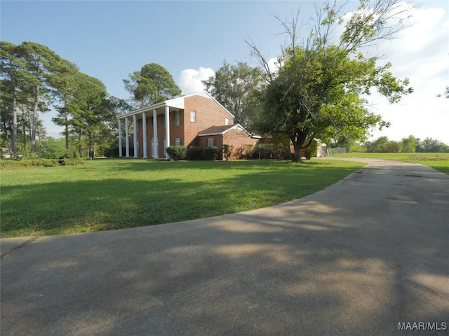 view of side of property featuring a lawn