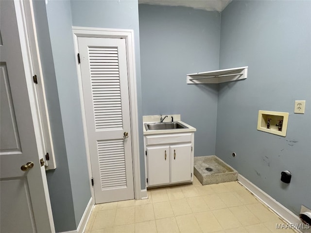 laundry area with sink, electric dryer hookup, washer hookup, and cabinets