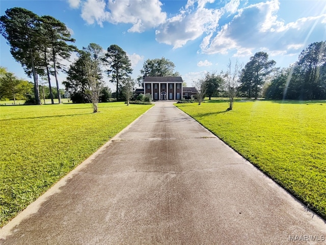 view of property's community with a lawn