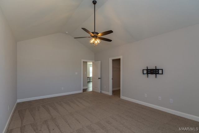 carpeted empty room with lofted ceiling and ceiling fan