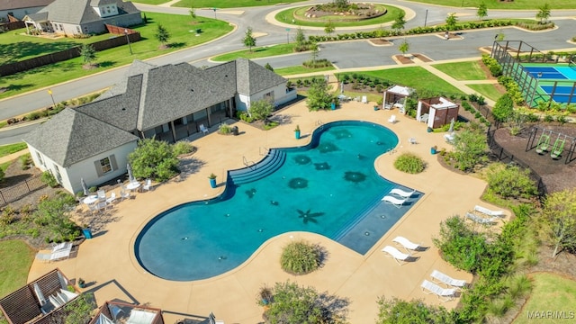 view of swimming pool with a patio area