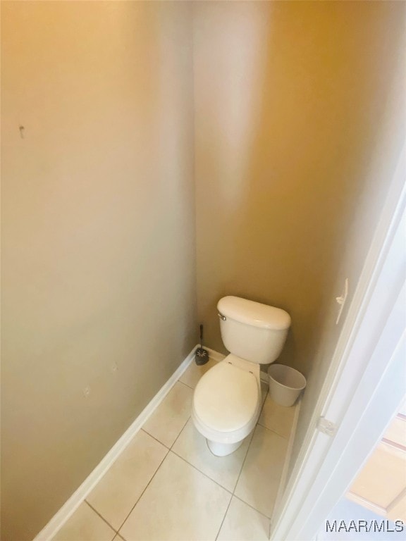 bathroom featuring tile patterned floors and toilet