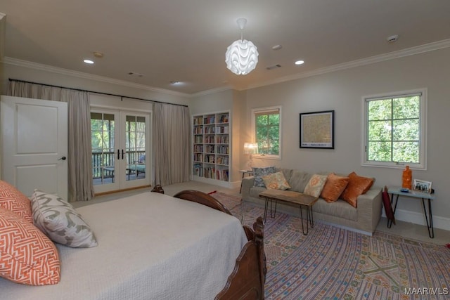 carpeted bedroom featuring multiple windows, access to exterior, and ornamental molding