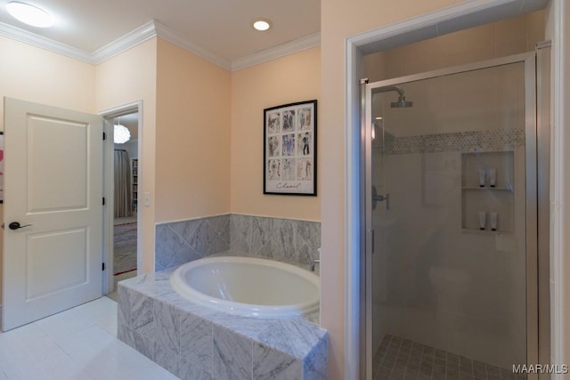 bathroom with ornamental molding and independent shower and bath