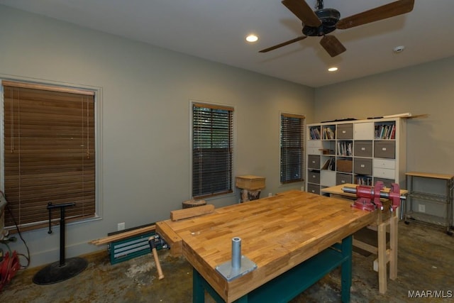 interior space with ceiling fan