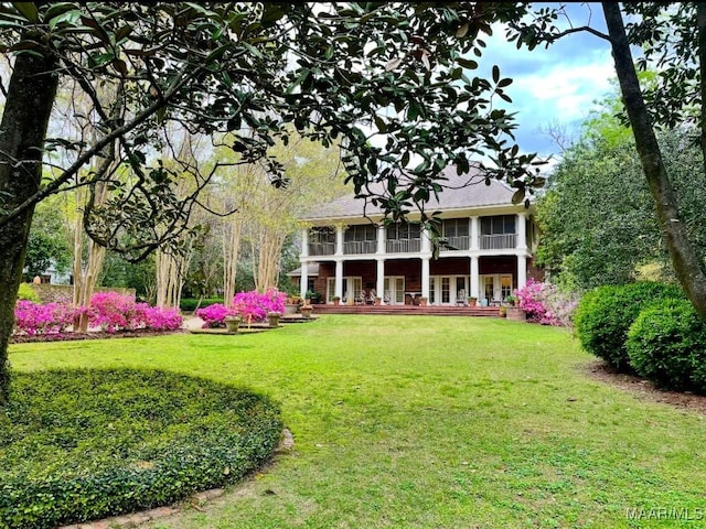 view of yard with a sunroom