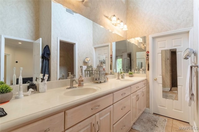 bathroom featuring tile patterned flooring and vanity