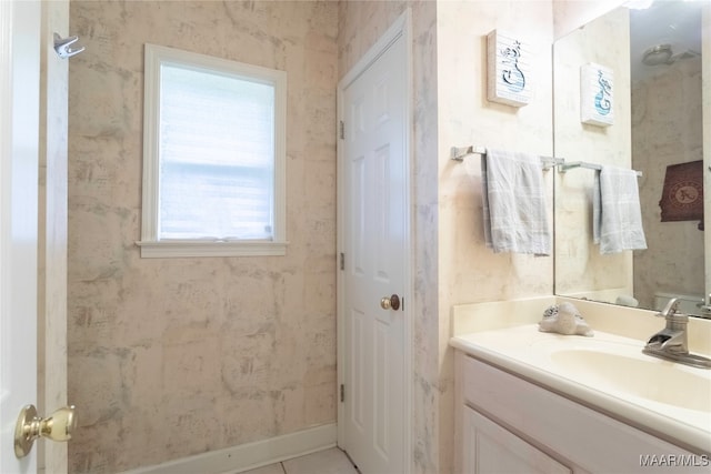 bathroom featuring tile patterned floors, vanity, and a wealth of natural light