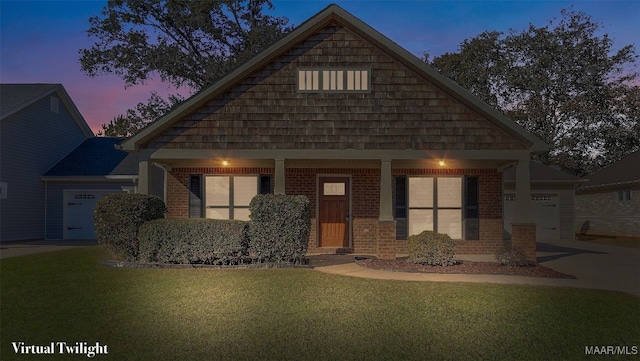 craftsman inspired home featuring a yard and a garage