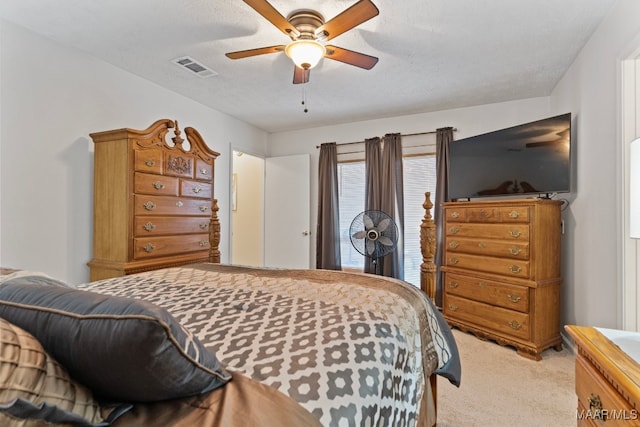 bedroom featuring access to outside, ceiling fan, light colored carpet, and a textured ceiling