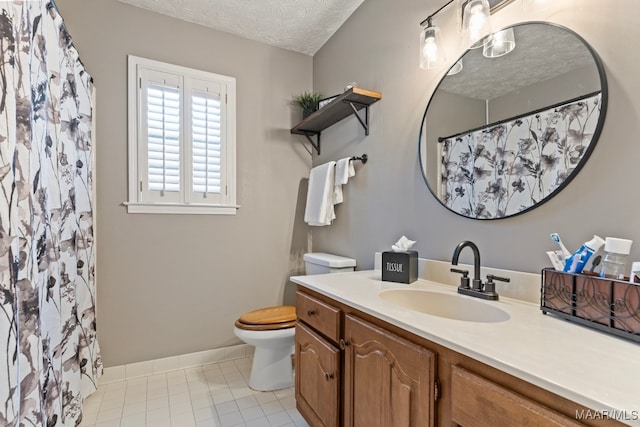 bathroom featuring a shower with curtain, tile patterned flooring, a textured ceiling, toilet, and vanity