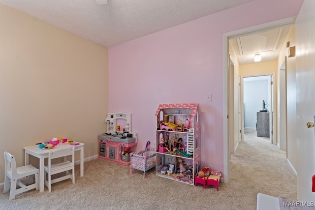 recreation room featuring a textured ceiling and light carpet