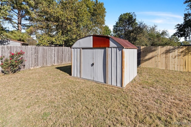 view of outbuilding with a yard