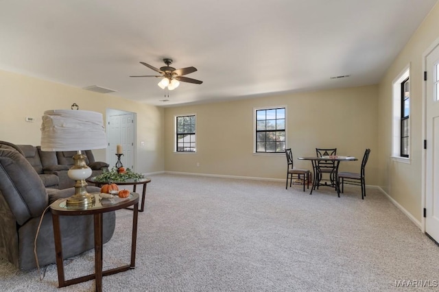 living room with light carpet and ceiling fan