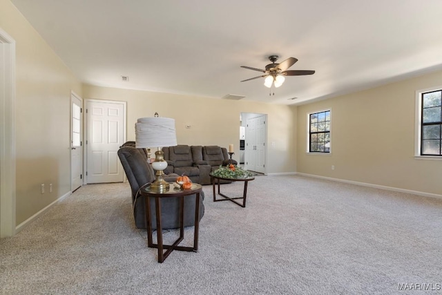 living room with light carpet and ceiling fan