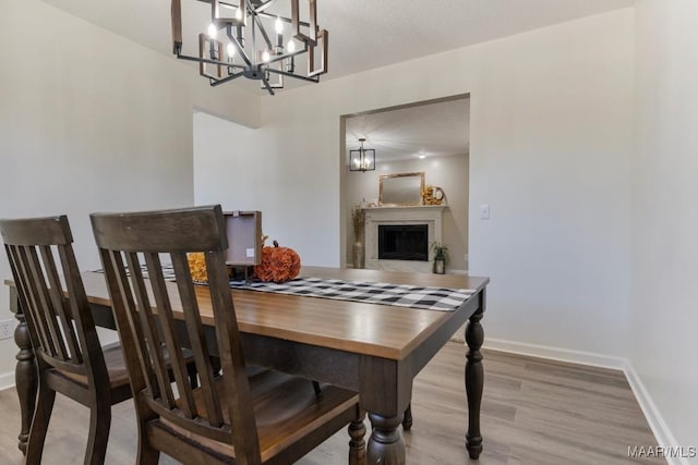 dining room featuring a chandelier and light hardwood / wood-style floors