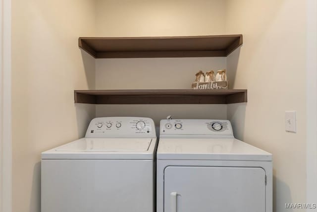 laundry room with washing machine and dryer