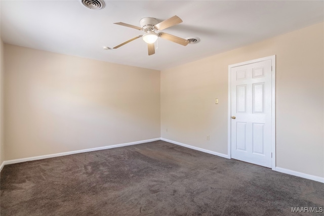 carpeted spare room featuring ceiling fan