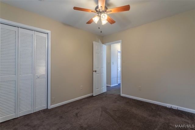 unfurnished bedroom featuring a closet, ceiling fan, and dark colored carpet