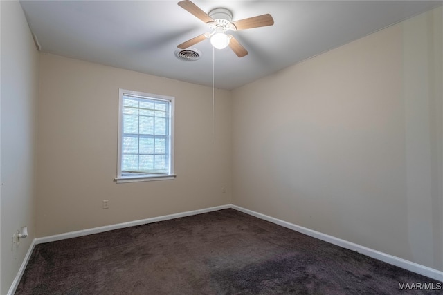 carpeted empty room featuring ceiling fan