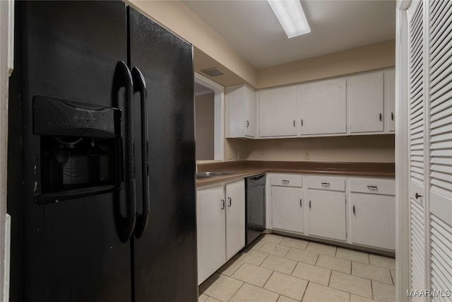 kitchen with white cabinetry, black appliances, and sink