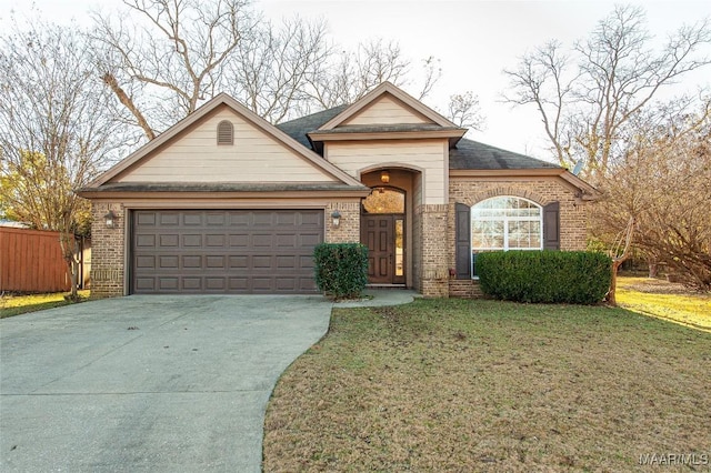 view of front of property featuring a garage and a front yard