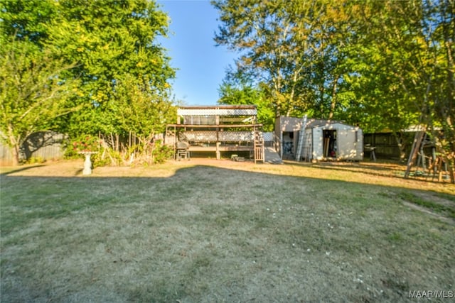 view of yard with a storage unit