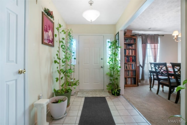 view of carpeted entrance foyer