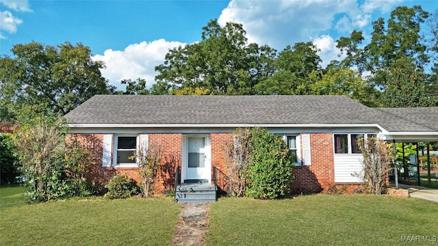 single story home with a carport and a front yard