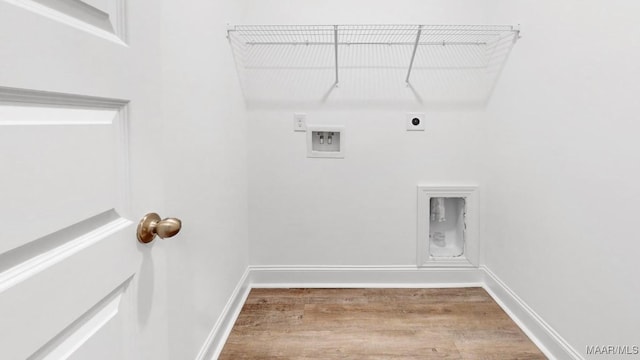 washroom featuring hookup for a washing machine, hardwood / wood-style floors, and hookup for an electric dryer