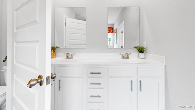 bathroom with vanity and toilet