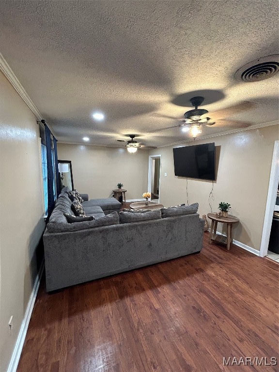 living room featuring a textured ceiling and dark hardwood / wood-style floors