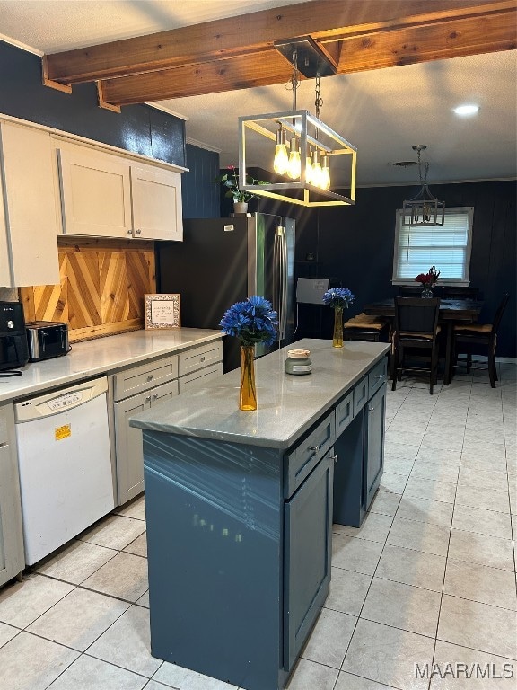 kitchen featuring light tile patterned flooring, white dishwasher, stainless steel fridge, hanging light fixtures, and beam ceiling