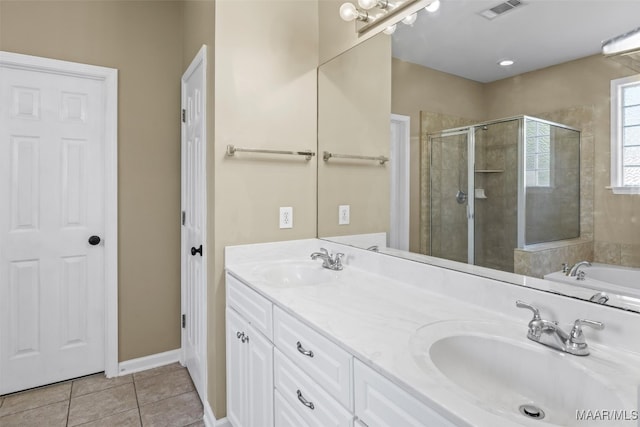 bathroom with vanity, tile patterned floors, and shower with separate bathtub