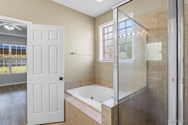 bathroom with separate shower and tub, wood-type flooring, and ceiling fan