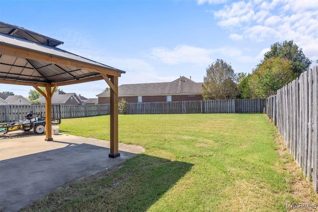 view of yard with a gazebo and a patio