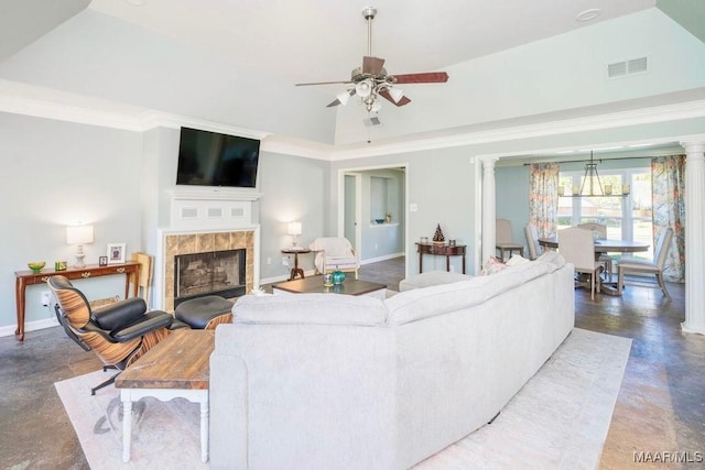 living room with decorative columns, crown molding, ceiling fan, and a fireplace