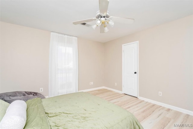 bedroom featuring ceiling fan and light wood-type flooring