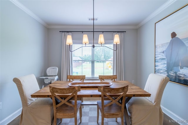 dining space with crown molding and a chandelier