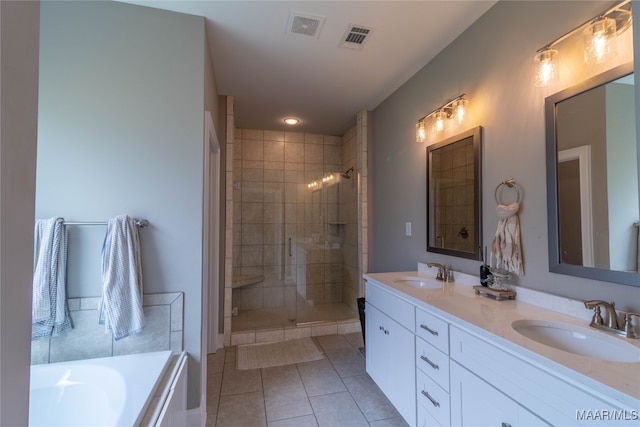 bathroom with vanity, shower with separate bathtub, and tile patterned floors