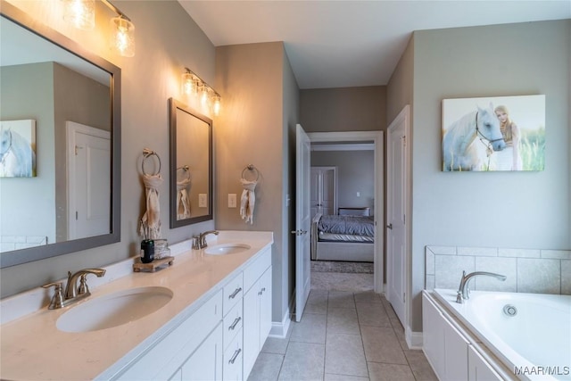 bathroom featuring tile patterned floors, a bath, double vanity, and a sink