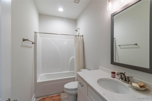 bathroom featuring vanity, toilet, visible vents, tile patterned flooring, and shower / tub combo with curtain