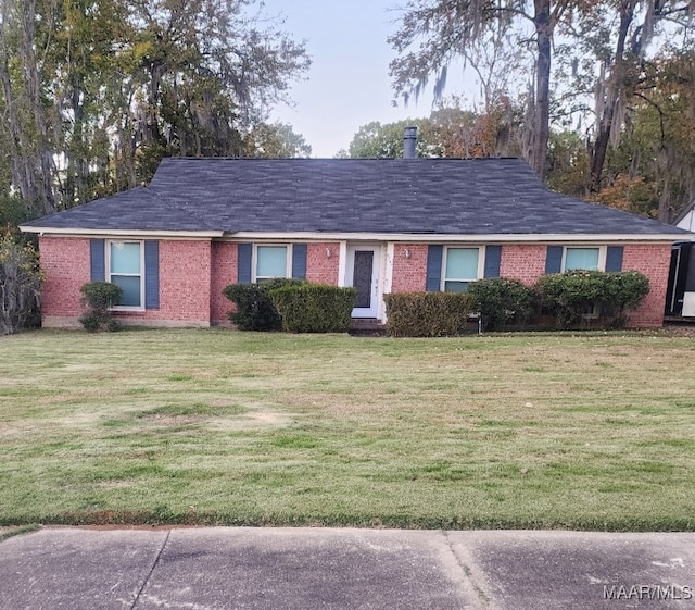 ranch-style home with a front yard