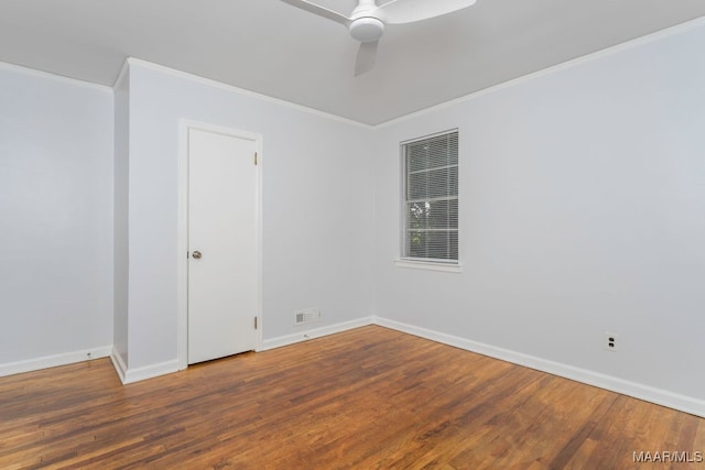 spare room with ornamental molding, wood-type flooring, and ceiling fan