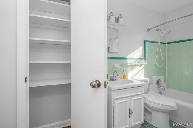 full bathroom with vanity, toilet, and tiled shower / bath combo