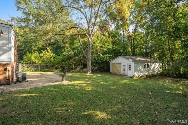 view of yard with an outbuilding and central AC unit