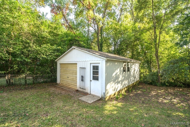 view of outdoor structure with a lawn