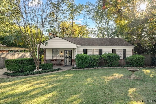 3712 Ware Ct, Montgomery, AL 36109 - ranch-style home with a porch, brick siding, fence, and a front lawn