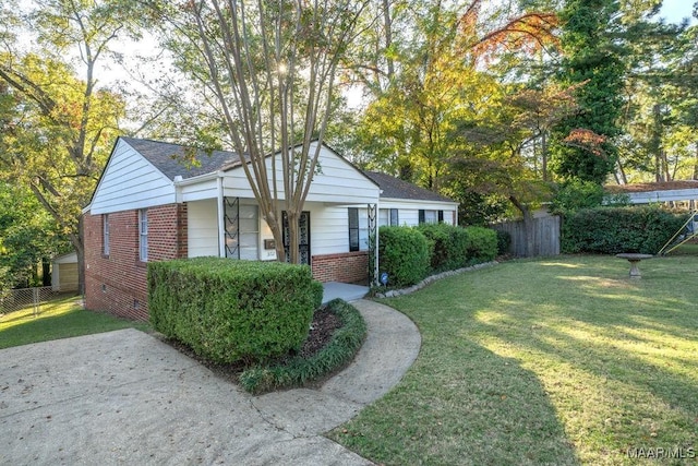 3712 Ware Ct, Montgomery, AL 36109 - view of front of house featuring brick siding, roof with shingles, fence, and a front yard